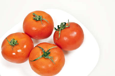 Isolated tomatoes on white backgroundの写真素材