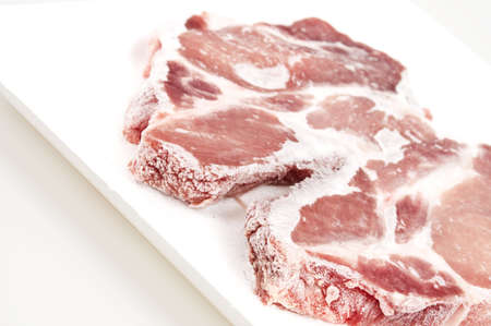 Two pieces of frozen meatの写真素材