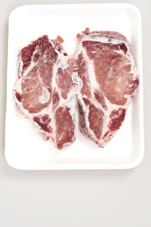 Two pieces of frozen meatの写真素材