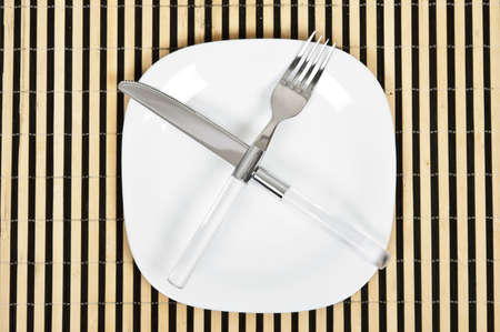 Isolated table arrangement with striped wooden supportの写真素材