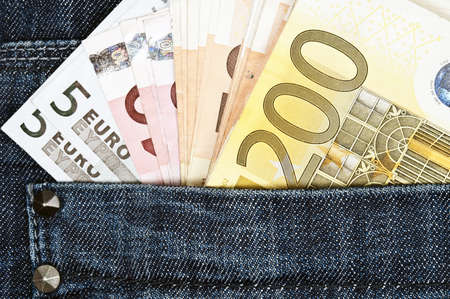 Euro banknotes in jeans back pocketの写真素材