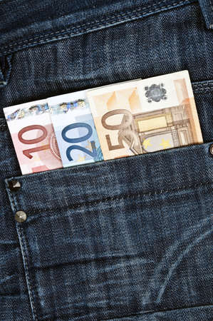 Euro banknotes in jeans back pocketの写真素材