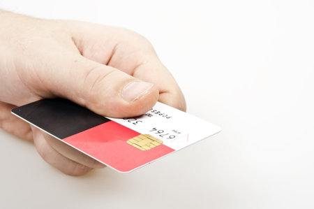 Male hand holding credit cardの写真素材
