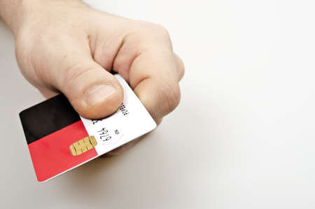Male hand holding credit cardの写真素材