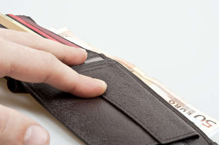 Wallet open full of banknotesの写真素材