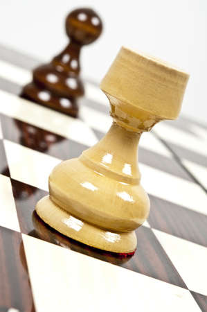Rook and pawn closeup on chessboardの写真素材