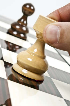 Rook and pawn closeup on chessboardの写真素材