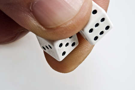 Isolated closeup of two dice ready to throwの写真素材