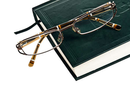 Isolated green book and eyeglassesの写真素材