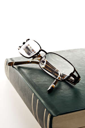 Isolated green book and eyeglassesの写真素材