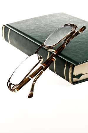 Isolated green book and eyeglassesの写真素材