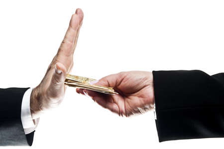 Business man refusing money offered by business womanの写真素材