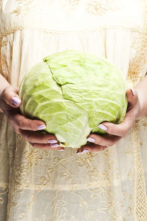 Housewife holding  a piece of cabbageの写真素材