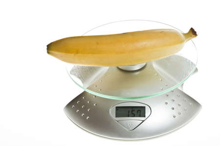 Banana isolated on food scaleの写真素材