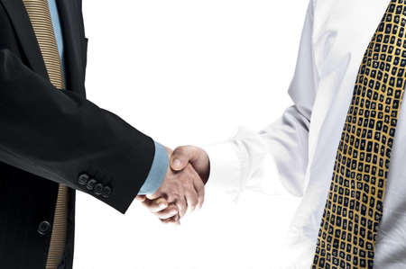 Old and young business people shake handsの写真素材