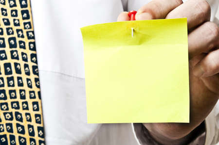 Business man with empty sticker in handの写真素材