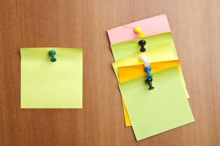 Six empty post it on wooden wallの写真素材