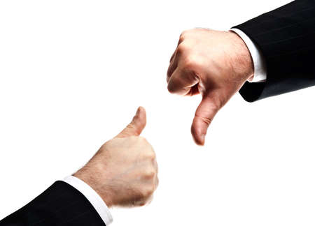 Isolated mature business man hands showing Yes and No signsの写真素材