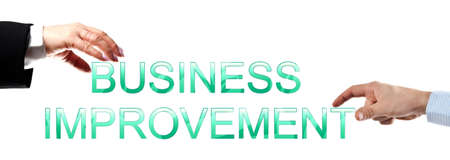 Business improvement words made by business woman and man handsの写真素材