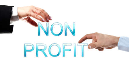 Non profit words made by business woman and man handsの写真素材