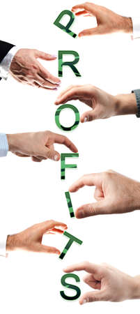 Profits word made by many business people handsの写真素材