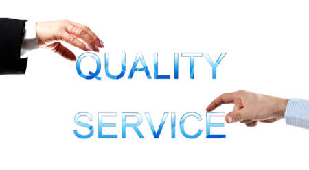 Quality service words made by business woman and man handsの写真素材