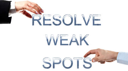 Resolve weak spots words made by business woman and man handsの写真素材