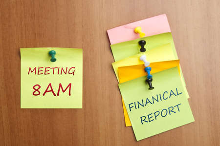 Meeting reminder post it on wooden wallの写真素材