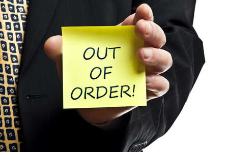 Out of order post it in business man handの写真素材