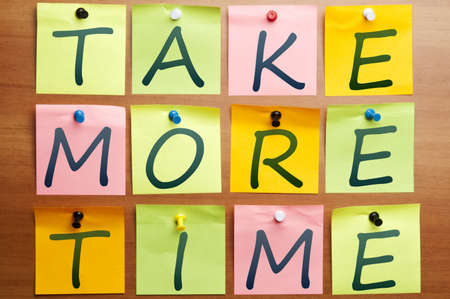 Take more time words made by post itの写真素材