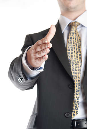 Isolated business man giving handの写真素材