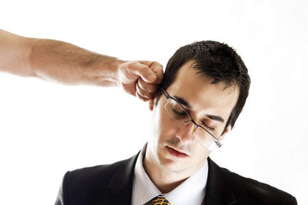 Isolated worker get a punch in headの写真素材