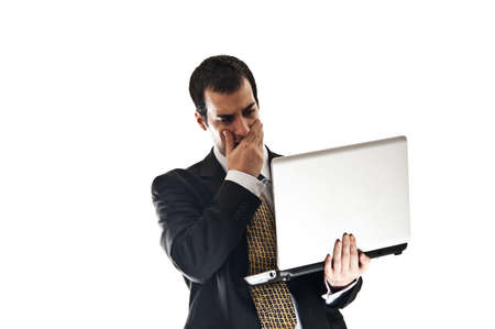 Isolated thoughtful business man with laptopの写真素材