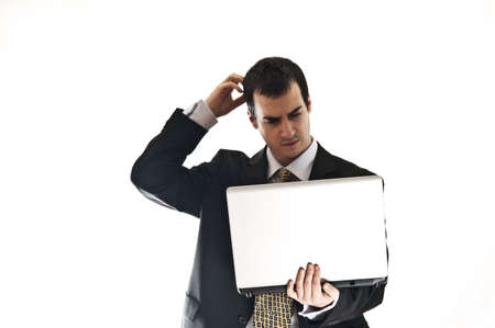 Isolated thoughtful business man with laptopの写真素材