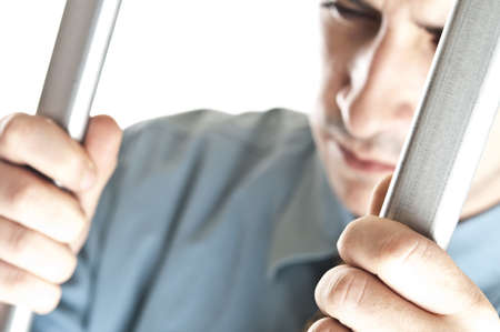 Isolated young man in jailの写真素材