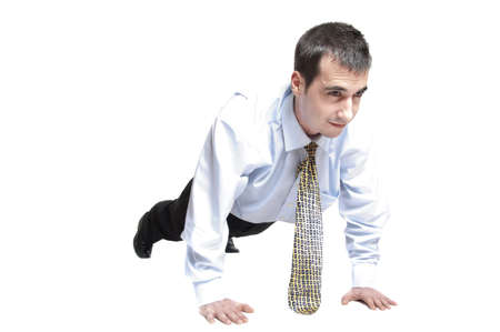Isolated business man doing push upsの写真素材
