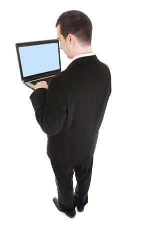 Isolated business man with laptopの写真素材