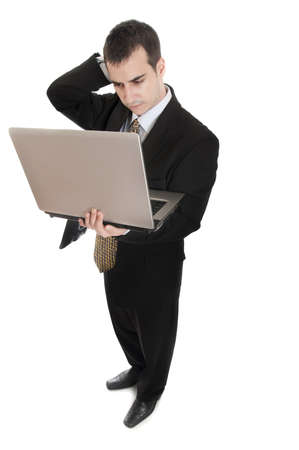 Isolated thoughtful business man with laptopの写真素材