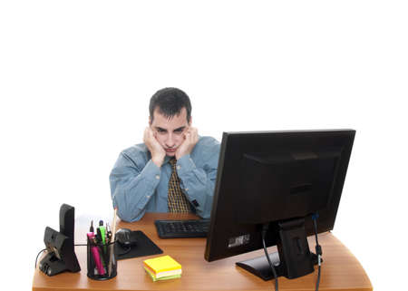 Isolated worker at office desk on white backgroundの写真素材