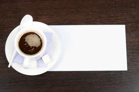 Coffee with blank note on deskの写真素材