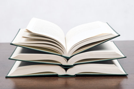 Open book on brown desk