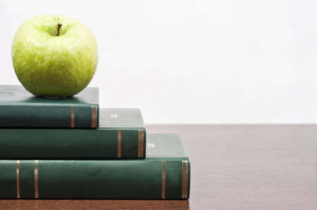 Close-up to book and appleの写真素材