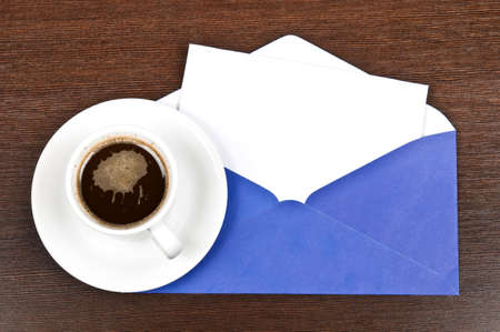 Coffee with blank note on deskの写真素材