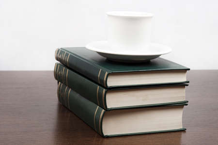 Books and coffe on deskの写真素材