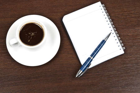 Coffee with blank note on deskの写真素材