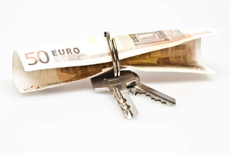 Banknote in keyring on whiteの写真素材
