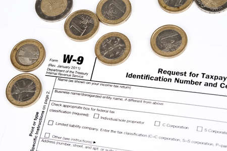 Tax form and money on deskの写真素材