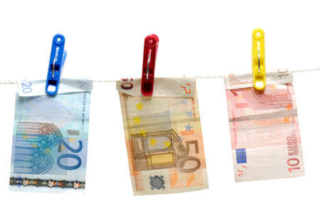 Money in clothespin hook on whiteの写真素材
