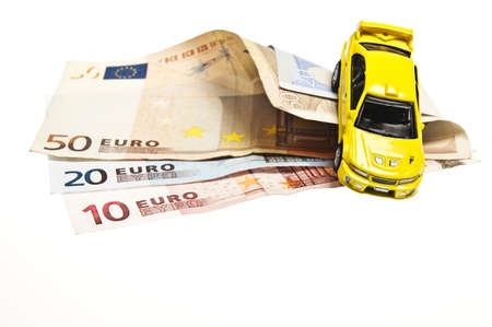 Yellow car on euro banknotesの写真素材