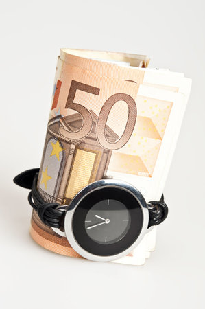 Fifty euro banknote and watch